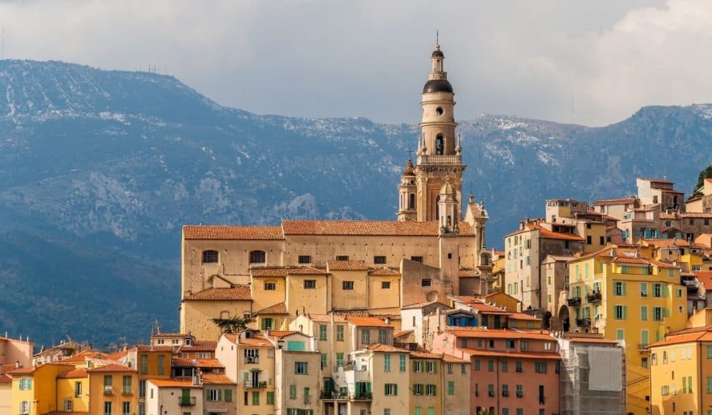Saint-Michel Basilica in Menton with mountains in the background. Saint-Michel Basilica in Menton with mountains in the background.
